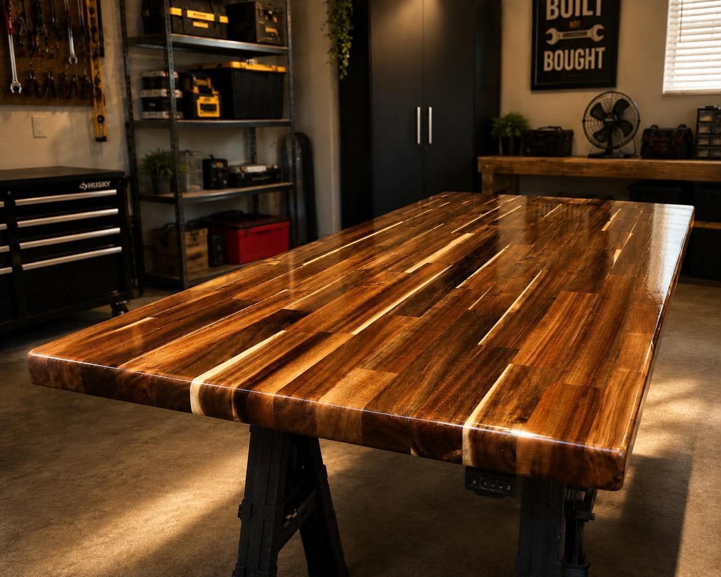 Live-edge acacia desktop with rich figured grain in a workshop
